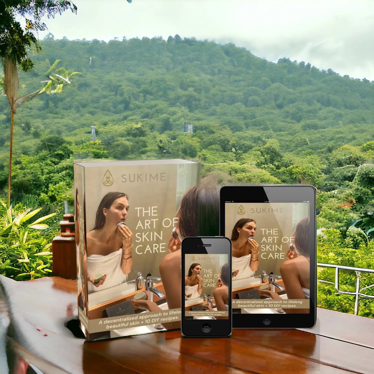 The Art of Skincare mockup Box, Phone and Tablet on wood table with Bali jungle background.